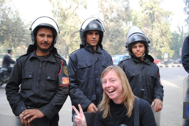 Three riot police in Cairo with one Canadian protestor (photo: Brandon Delyzer bdelyzer@uvic.ca)