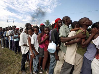 Haitians in Cité Soleil queue for food after the earthquake, in January 2010. Photo: The United Nations