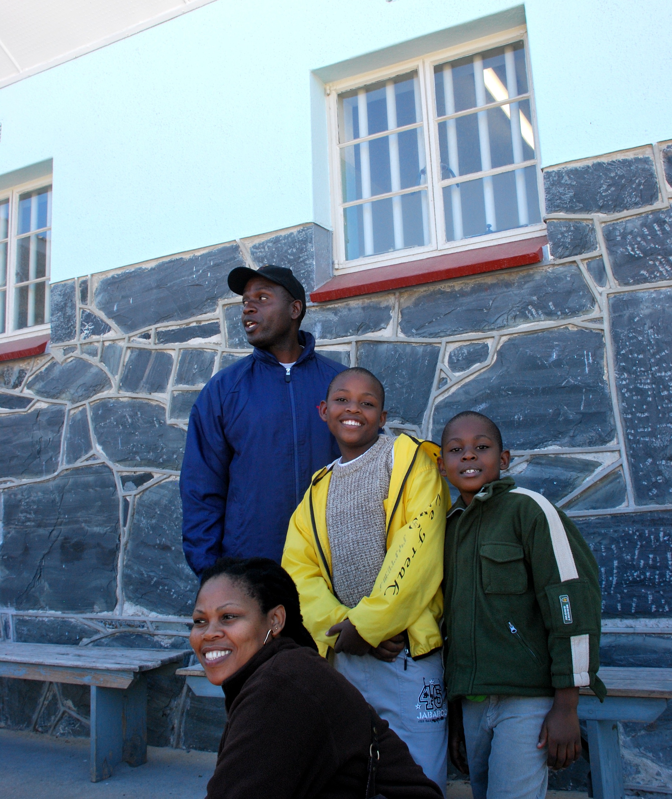 Botswana family - Mandela cell window - Robben Island 2 0092