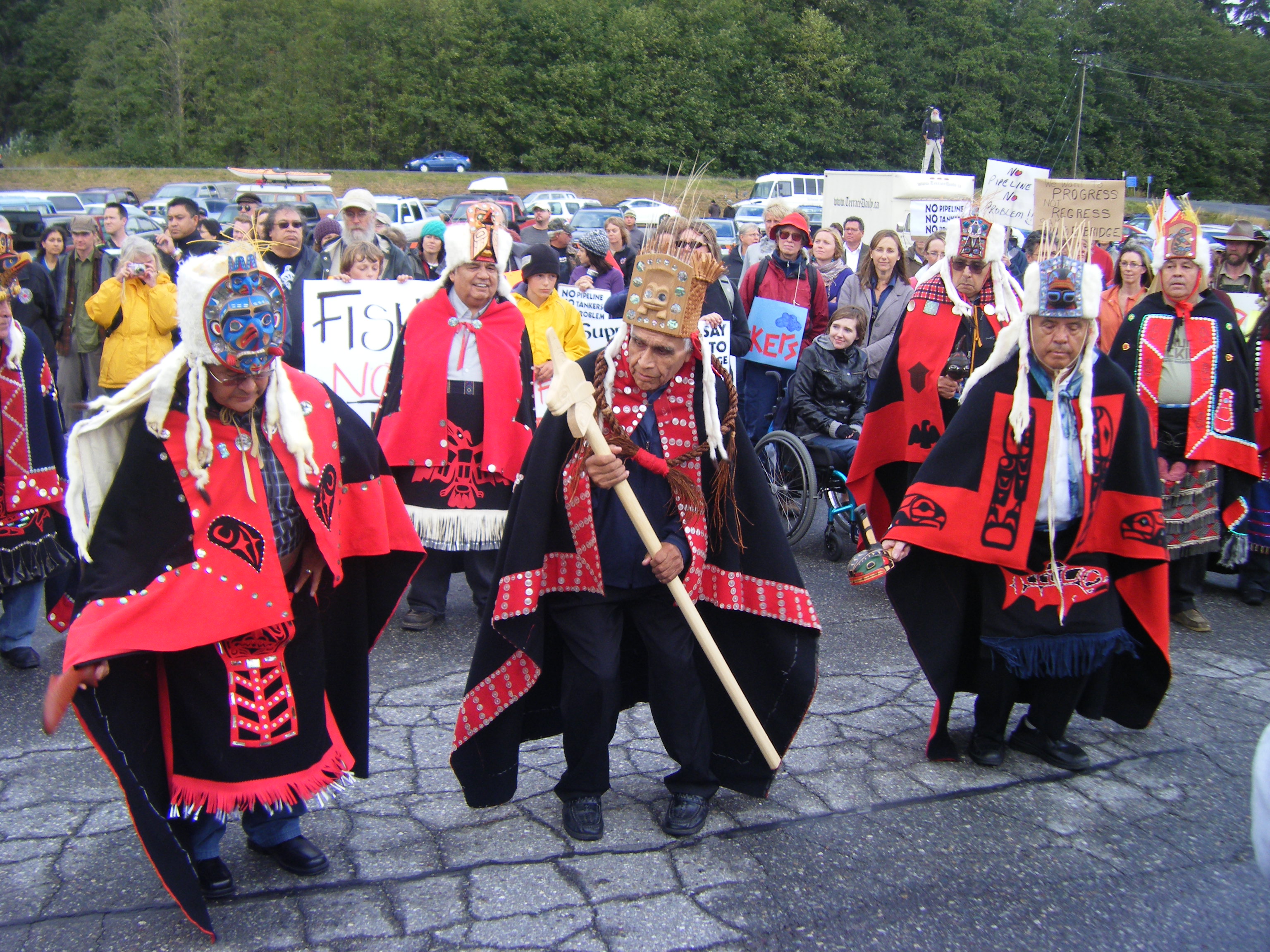 Members of the Heiltsuk First Nation from Bella Bella dancing in regelia at rally