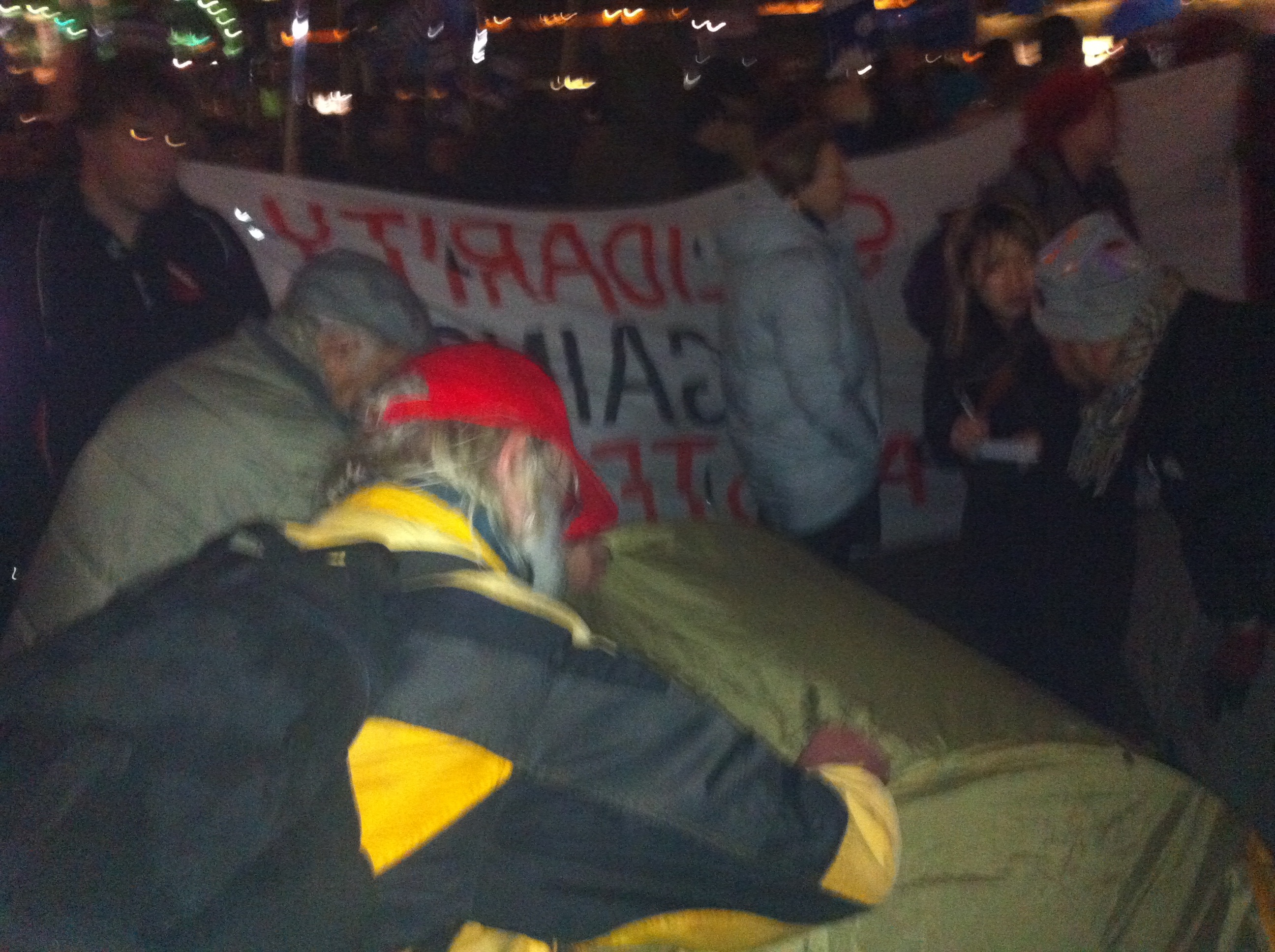 Activists write messages to Ford on Occupy City Hall tents. Photo: Krystalline Kraus