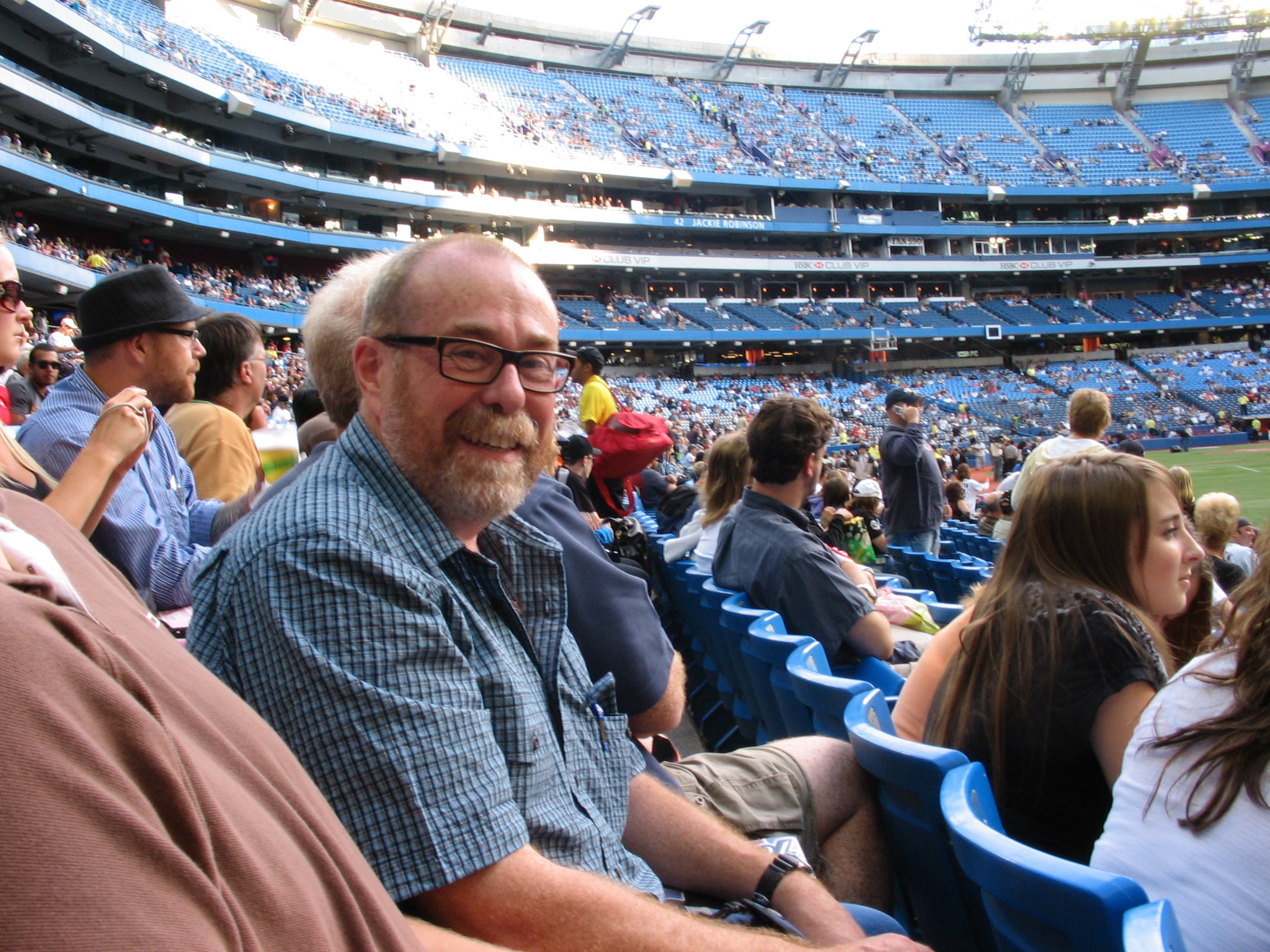 The author, at a Jays game, stuck in the Yankees section.