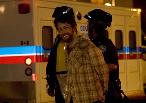 Journalist Jesse Rosenfeld is arrested and taken away to the detention centre. Photo: Activestills