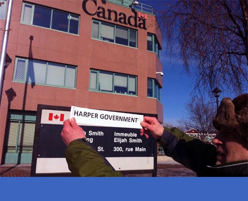 What you see is what you'll get: Whitehorse's David Skelton protests Harper's vision of the Yukon's Federal Building on Tuesday, March 8. Photo: Meagan Perry.