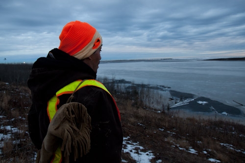 Mike Orr looking out over the man-made tailings lake. Photo: Ben Powless