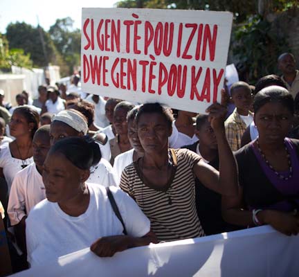 Sign reads, "If there is land for factories there should be land for houses." Photo: Ben Depp