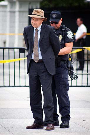 Climate scientist James Hansen being arrested at the Keystone XL pipeline protests at the White House. Photo: Ben Powless