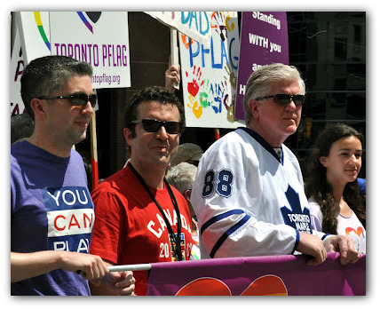 Brian Burke marches with PFLAG during the Pride Parade in Toronto. (Photo: James Hamilton.)