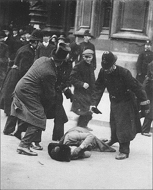 cop beat women protesters