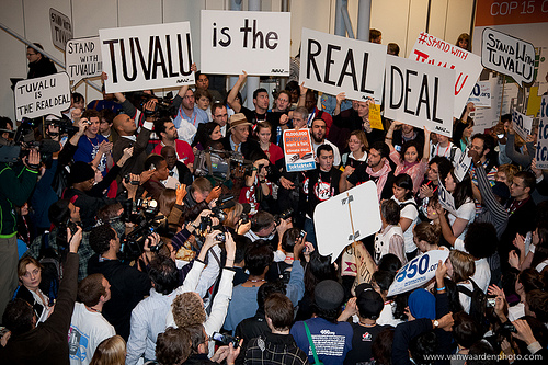 a picture of youth from around the globe standing in solidarity with Tuvalu and Small Island States