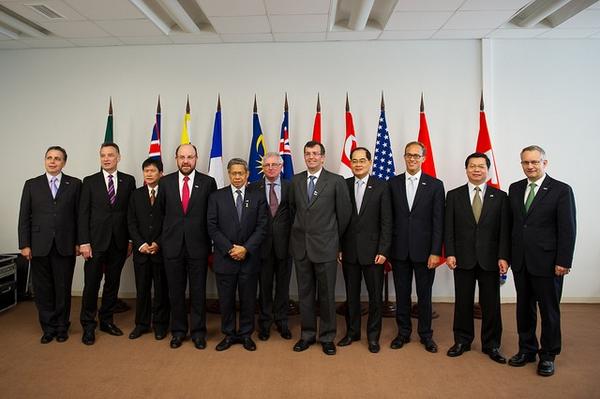 TPP trade ministers pose for cameras during the APEC summit in Russia, September