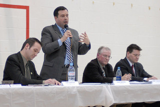 Jason Kenney answering questions at an all candidates meeting in Calgary.