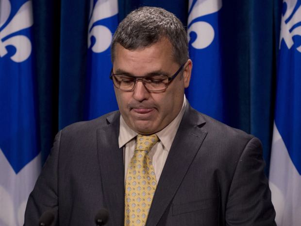 Quebec Environment Minister Daniel Breton tears up while announcing his resignat