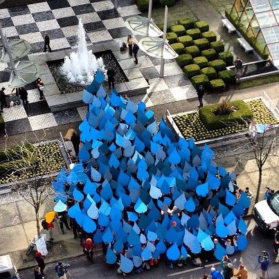 Activists formed a giant blue drop outside the Enbridge hearings in Vancouver. (