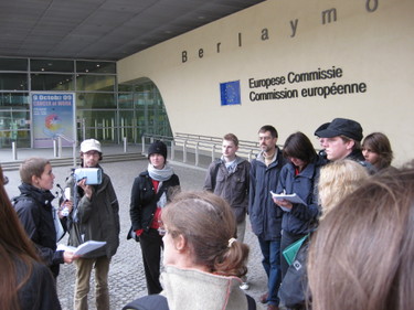 Pia Eberhardt (far left) discusses corporate lobbying with a group in front of t