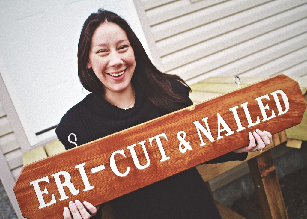 Erica Ryan-Gagne displays Eri-Cut & Nailed signage outside of her new salon loca
