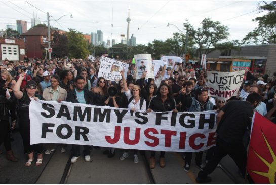 sammy_yatim_crowd_with_banner