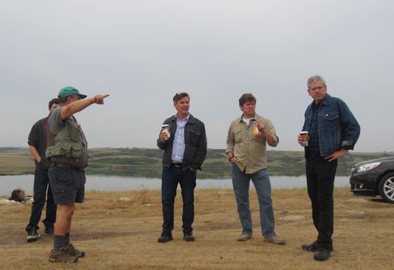 Charlie Angus with publisher Bruce Walsh, author James Daschuk and video crew at