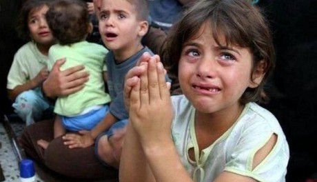 Children in Gaza crying after parents were murdered by Israel