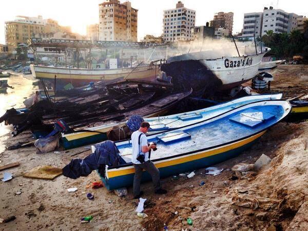 The remains of Gaza's Ark beside an undamaged boat.