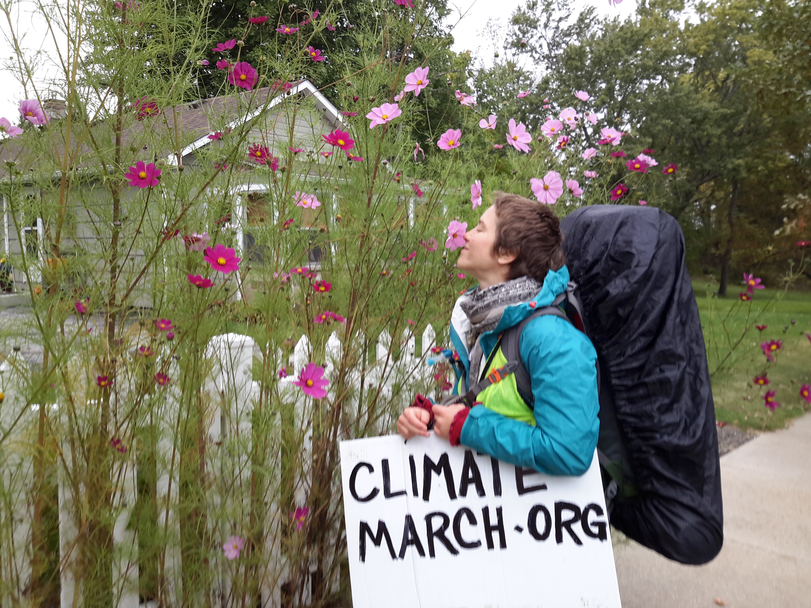 Sean smells the flowers on the Great Climate March