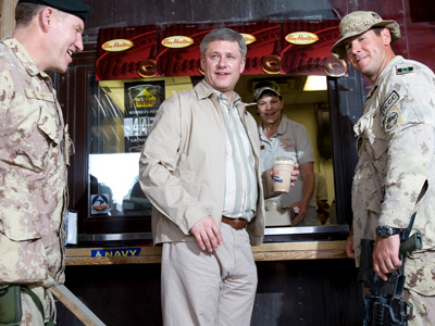 Prime Minister Stephen Harper in Afghanistan in 2009, enjoying a Tim Hortons cof