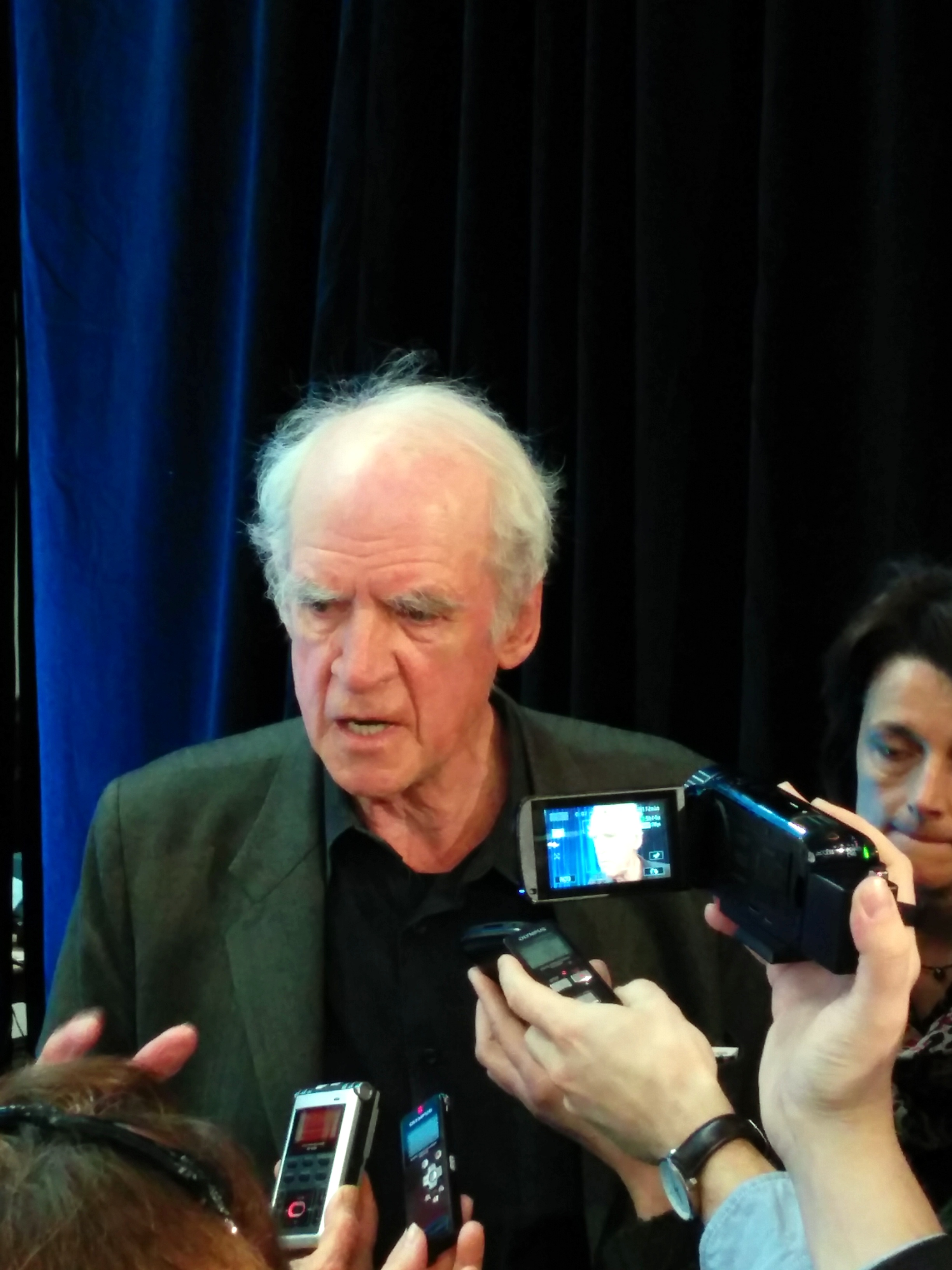 Philosopher Charles Taylor in media scrum