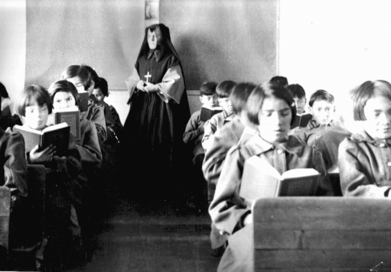 Photograph of students from Fort Albany Residential School reading in class