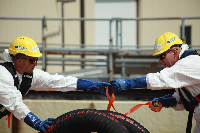 Two Norwegian NOFI workers participate in an oil spill clean-up contest