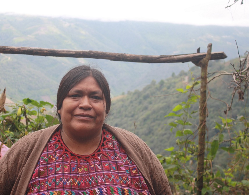 A CEIBA promoter in Santiago, Guatemala with valley behind her.