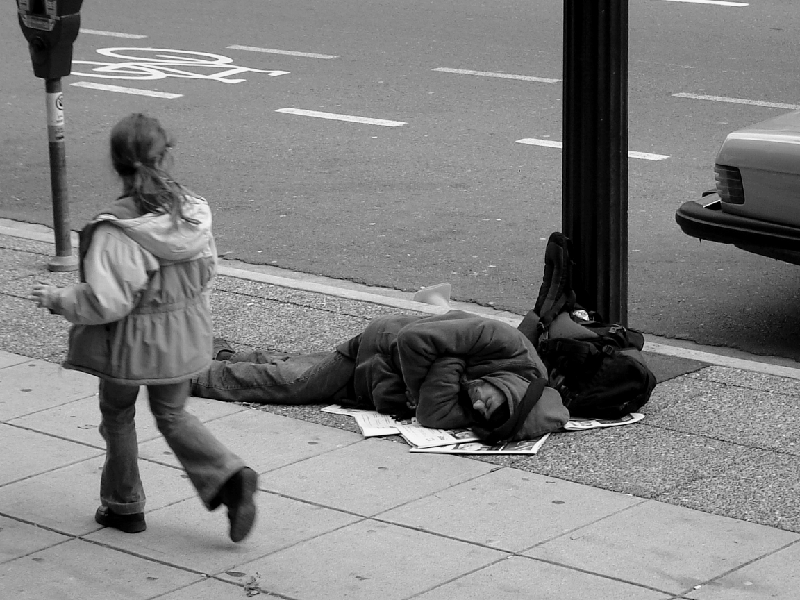 man_sleeping_on_canadian_sidewalk