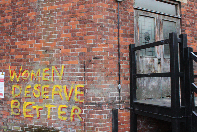 Women deserve better spray painted on a brick wall.