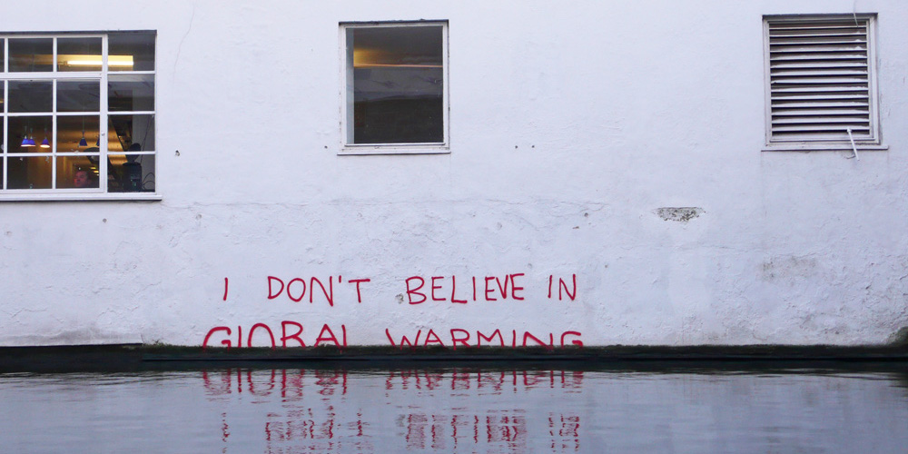 "I don't believe in Global Warming" on a wall. Climate change denial by Banksy