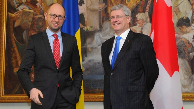 Arseniy Yatsenyuk, former Ukraine PM, with then Canadian prime minister Stephen Harper in July 2015. (Screen capture of CBC broadcast.)