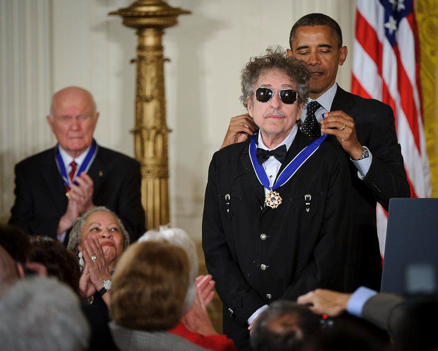 President Barack Obama presents American musician Bob Dylan with a Medal of Freedom.