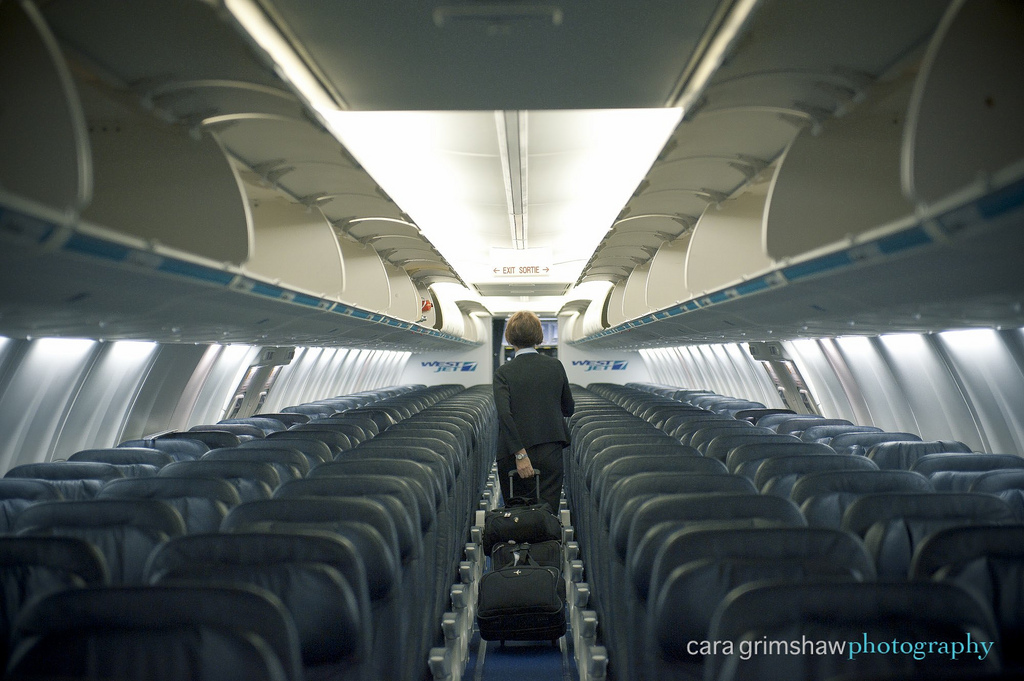 Back of Westjet flight attendant. Creative Commons licensed photo: Cara Grimshaw Photography/flickr