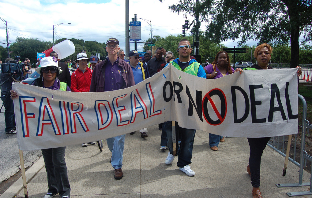 People with banner. Photo: Peoples World/flickr