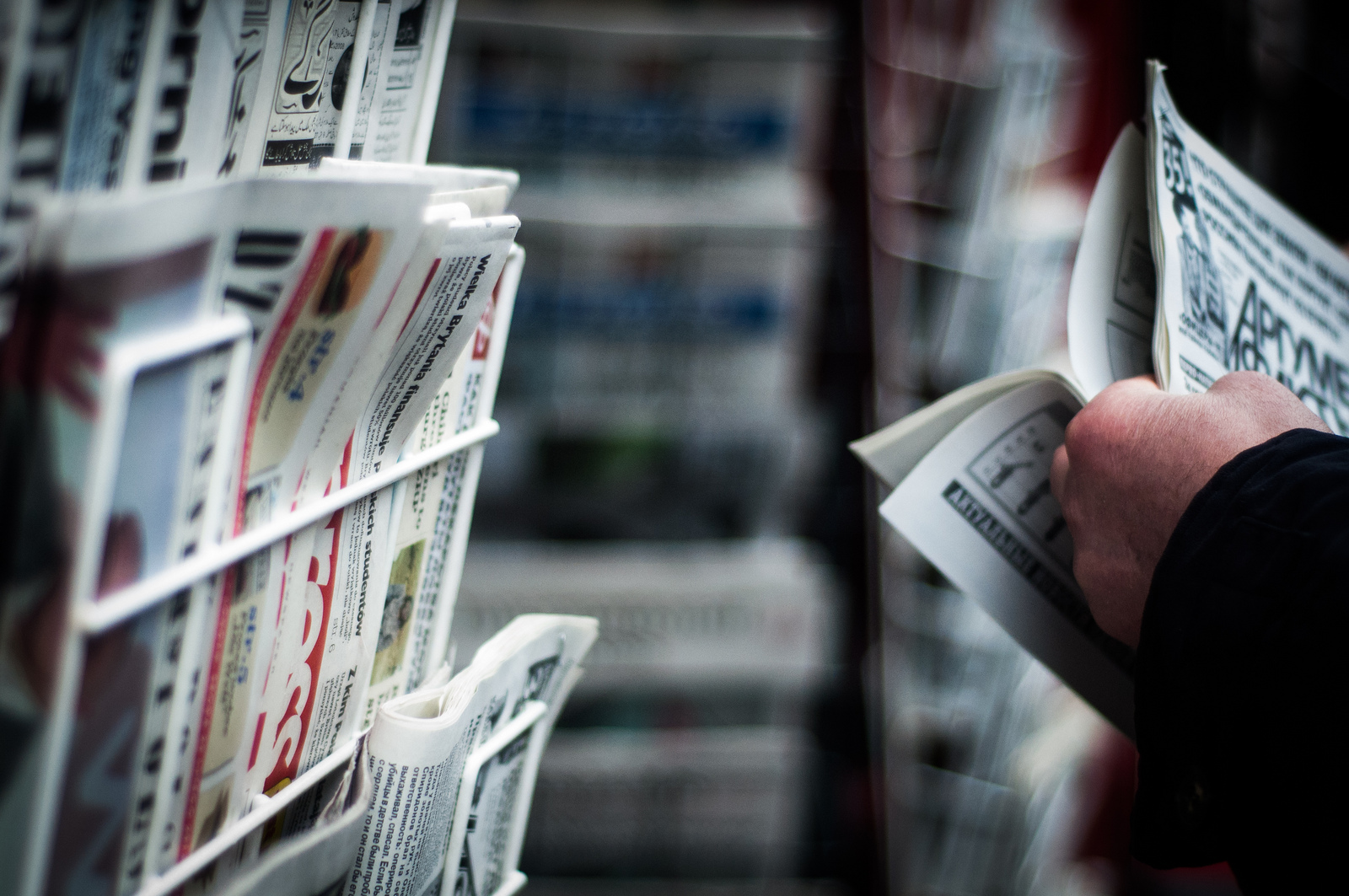 Newspapers on newsstand. Photo: greenzowie/flickr