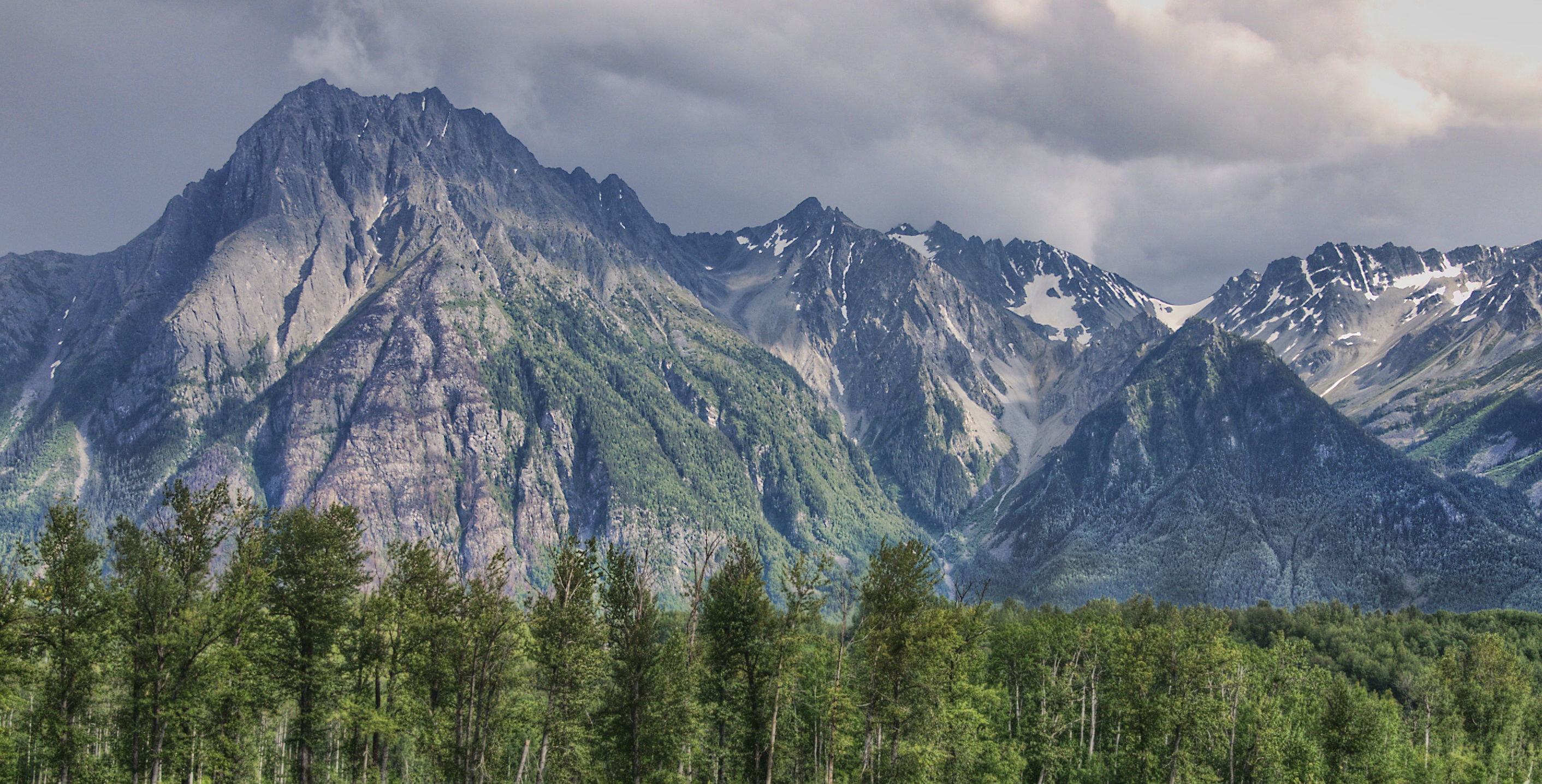 Stegyawden (also known as Hagwilget Peak and the Roche de Boule mountain range) looking across the Bulkley River near its confluence with the Skeena River, Hazelton British Columbia, Canada.