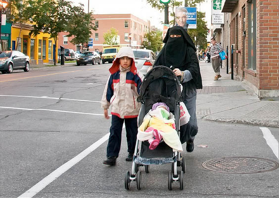 A woman wearing a niqab on Rue Ontario in Montreal in 2012. Photo: Claude Robillard/Flickr
