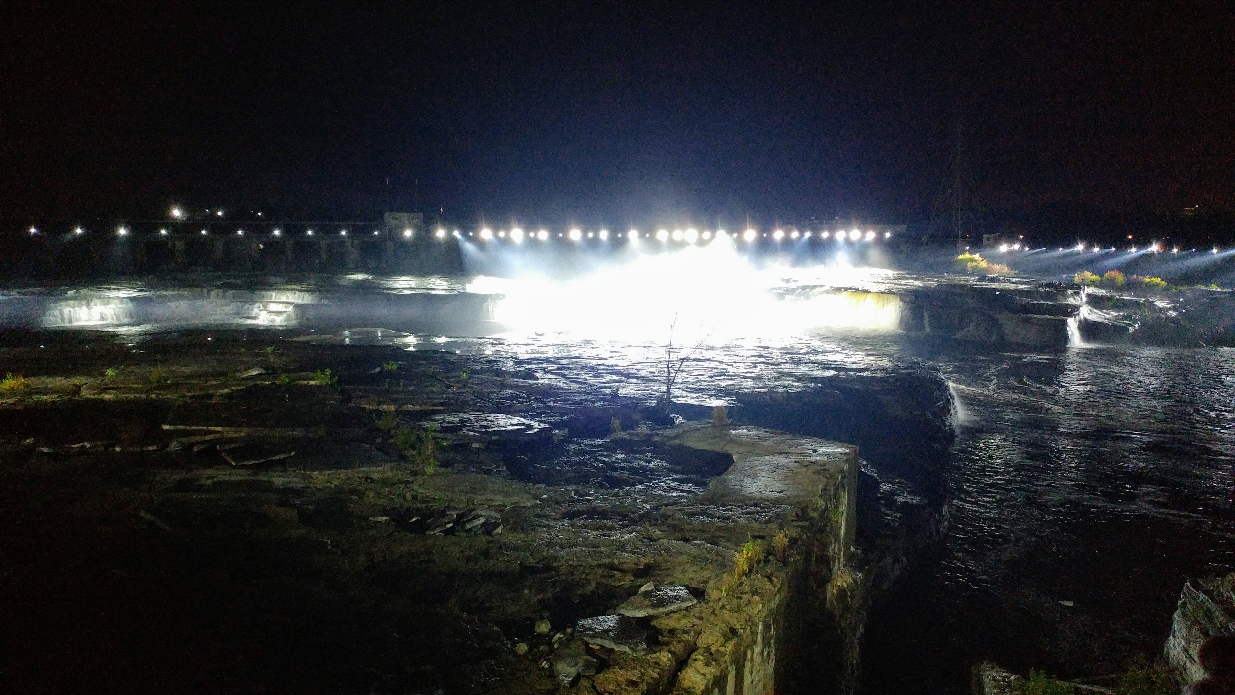 Mìwàte's dazzling lights distract from the dam that imprisons the falls. Photo: Dr. Julie Comber