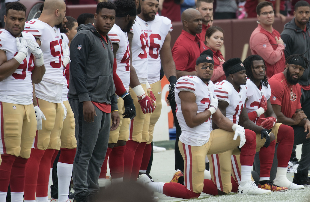 Members of the San Francisco 49ers kneel during the national anthem before a game against the Washington Redskins at FedEx Field on October 15, 2017, in Landover, Maryland. Photo: Keith Allison