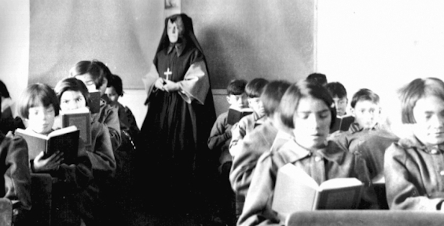 Students from Fort Albany Residential School reading in class overseen by a nun. Photo: Wikimedia Commons