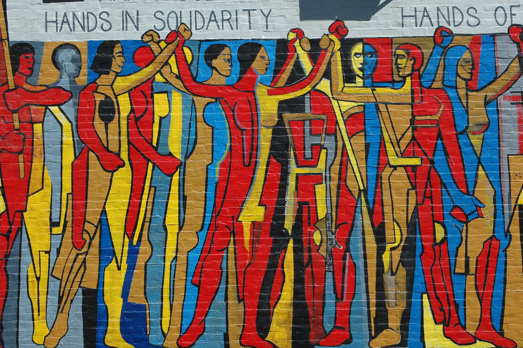 Hands in Solidarity, Hands of Freedom mural on the side of the United Electrical Workers trade union building on West Monroe Street at Ashland Avenue in Chicago, Illinois. Photo: Terence Faircloth/Flickr