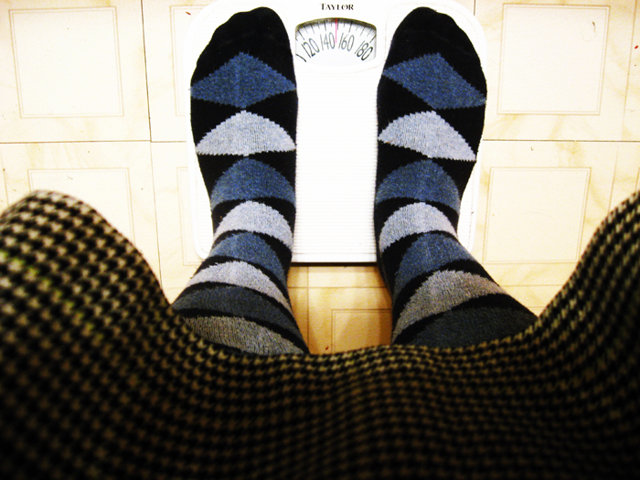 Feet on a scale. Photo: Jodi Green/flickr