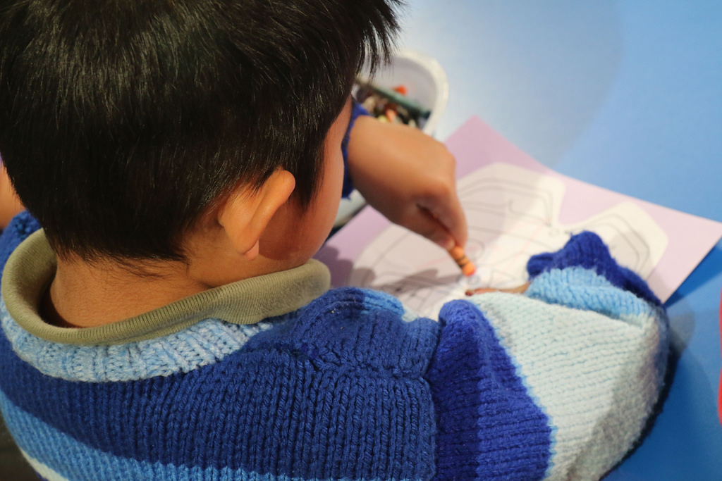 Child colouring. Photo: Province of British Columbia/Flickr