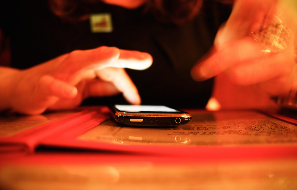 Person touching cellphone. Photo: Jaypeg/Flickr