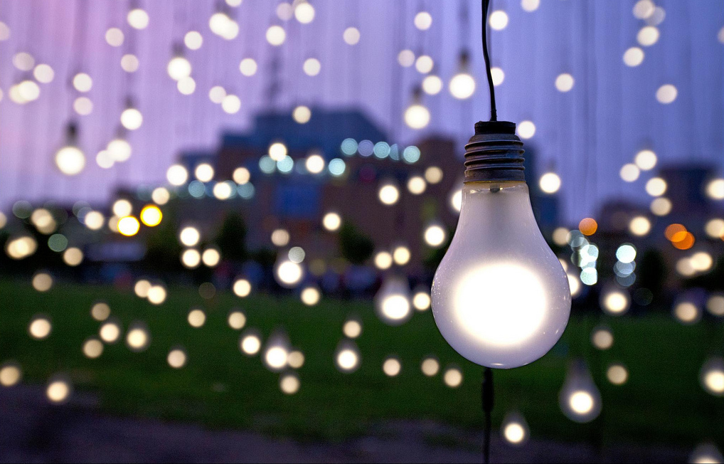 Art exhibit by Jim Campbell showing suspended light bulbs. Photo: Dusty Hoskovec/Northern Spark/Flickr