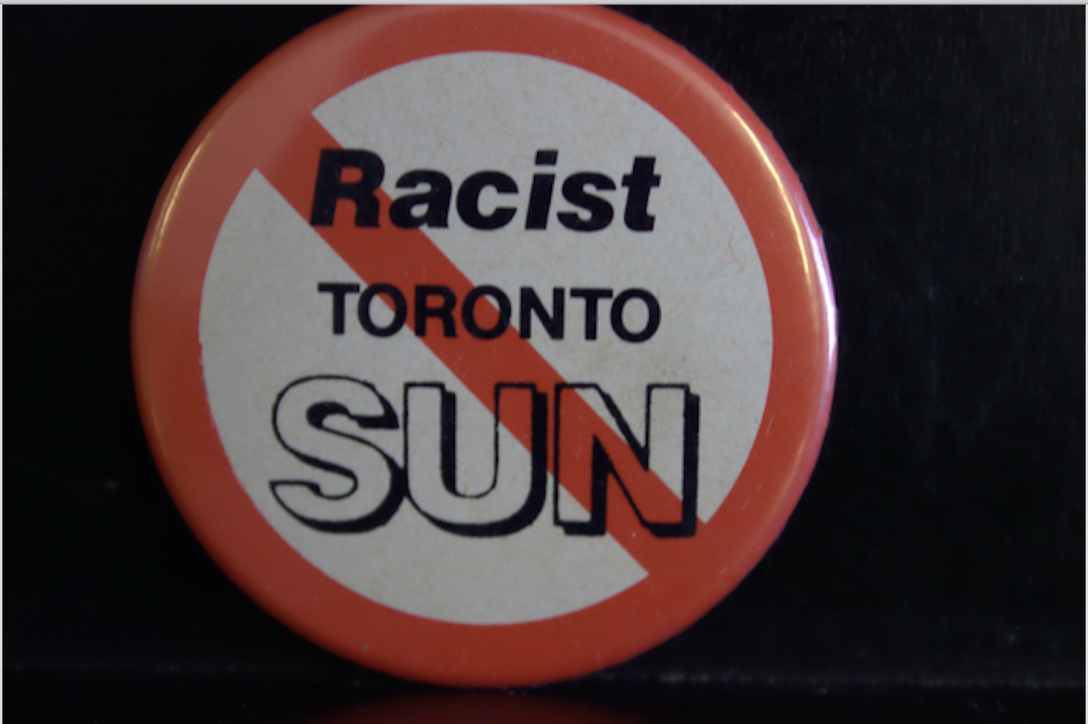 Vintage Racist Sun button. Photo: York University Libraries