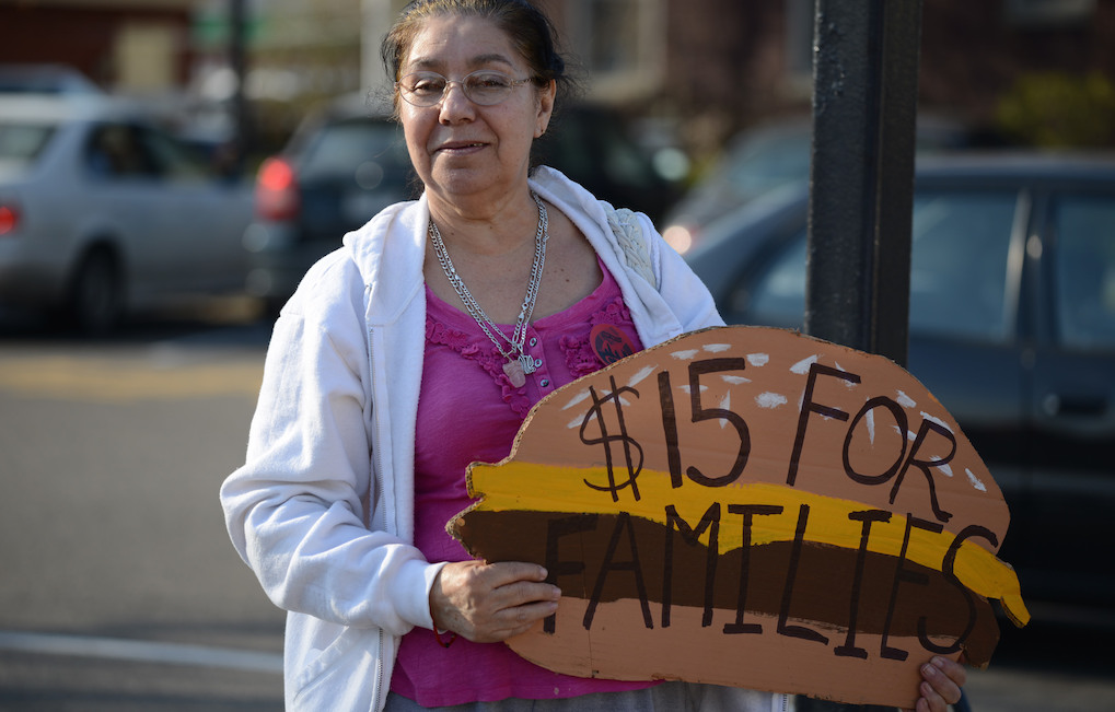 Woman protests for a higher minimum wage. Photo: Fibonacci Blue/Flickr